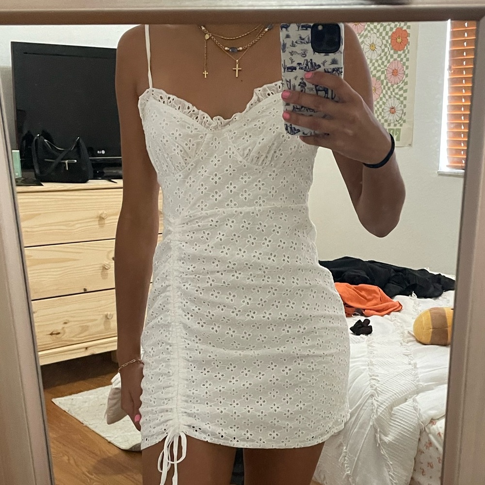 White mini dress, size small. Graduation style dress with eyelet detail.